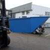 Blue harvesting bin on forks