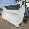 White marc bin tilted on forklift